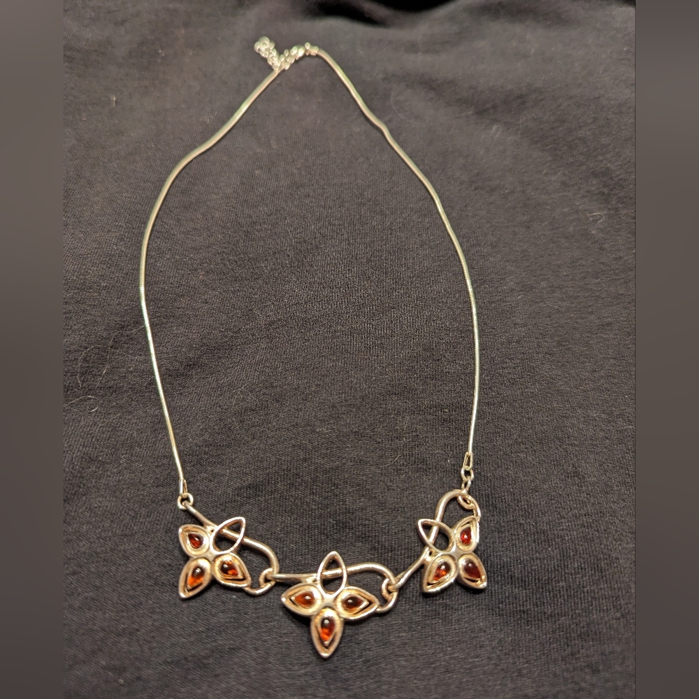 Silver necklace with red beads